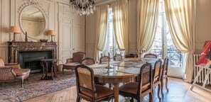dining table for 6 people, coffee table, 2 armchairs, decorative fireplace,