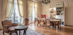 dining table for 6 people, coffee table, 2 armchairs, decorative fireplace,