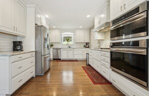 Fridge/freezer, convection oven, gas stove, microwave, dishwasher. Coffee bar.