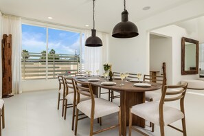 This elegant dining table offers ample seating for eight, making it the perfect setting for family meals and festive gatherings.