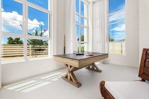 Enjoy endless hours of fun with the ping-pong table, perfect for both friendly matches and casual play.