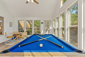 Pool table & games in the sunroom for endless fun with the family. 
