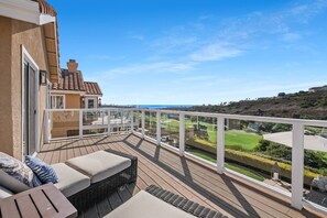 Spacious ocean and golf course view balcony off Master