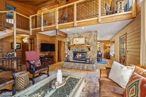Gorgeous two sided fireplace to heat the living space as well as dining space. Open air loft.