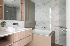 A warm & cozy bathroom with a Japanese bathtub.