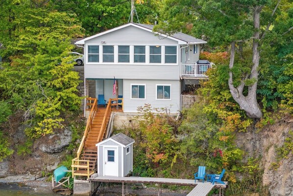 Serenity Cottage's lakeside view is simply unmatched. Relax on the deck, take in the fresh breeze, and enjoy the peaceful sounds of nature. This is the perfect spot for a tranquil getaway. 