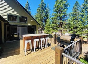 Island with bar stools on deck