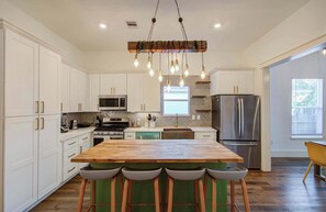 Modern, charming, and functional, this fully-equipped kitchen looks like it waltzed off the pages of an interior design magazine!