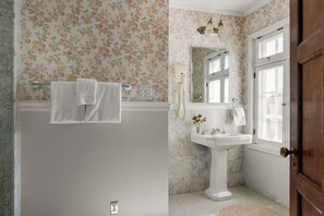 The primary ensuite bathroom has single vanity.