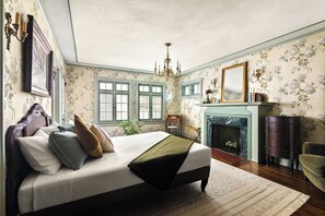 On the second level, guest room 1 features a king-sized bed, fireplace and ensuite bathroom.