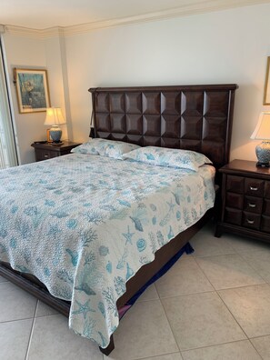 Master bedroom king bed. Balcony overlooks beach.