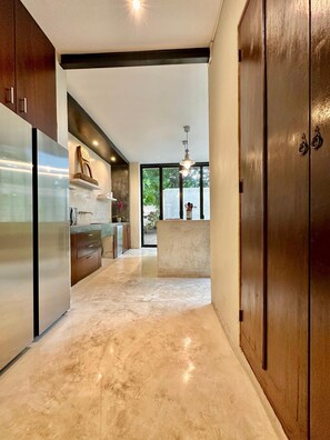 Entry to kitchen and closet for washer