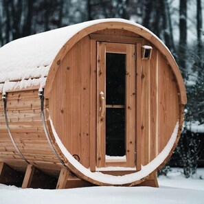 Rejuvenate in the high-quality Finnish barrel sauna! The circular design ensures even heat distribution, creating a perfect environment for deep relaxation.