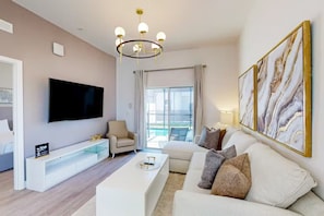 Unwind in the generous living room, perfect for family gatherings and cozy movie nights.