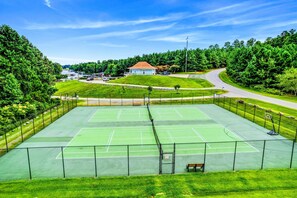 Well-maintained tennis courts set in a green and serene environment, perfect for an active outdoor experience