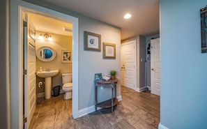 Hallway with half bathroom