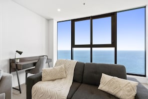 Spacious and cozy living area for the guests to relax overlooking the ocean