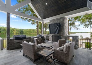 Outdoor sitting area with pellet grill, oven, and EVO