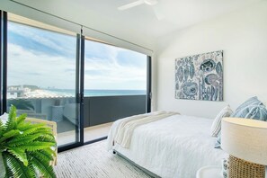 The second bedroom is beautifully appointed with ocean glimpses direct from the pillow of its queen size-bed.
