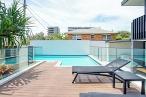 Make a splash in the residents’ pool with day beds to soak up the sun.