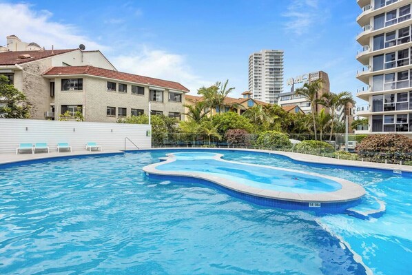 The building offers several shared spaces and amenities for guests including a generously sized pool, where guests can cool down with a dip or lounge poolside with a book.