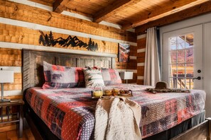 Spacious master bedroom with mountain views right from our brand new king bed! You can literally wake up in awe every morning to the glow of a Smoky Mountain sunrise!
