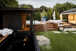Create memories in this private backyard oasis—complete with outdoor seating, dining space, a cozy fire pit, refreshing outdoor shower, relaxing spa, cold plunge, and a rejuvenating sauna for a true spa-like experience. There’s plenty of room for the whol