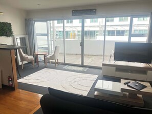 Full length ranch sliders allow the sun to pour in. Enjoy the outside deck