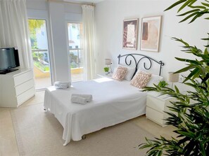 Master bedroom with double bed and access to the terrace