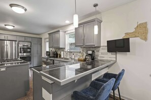 Sleek and Sophisticated Kitchen with an Island