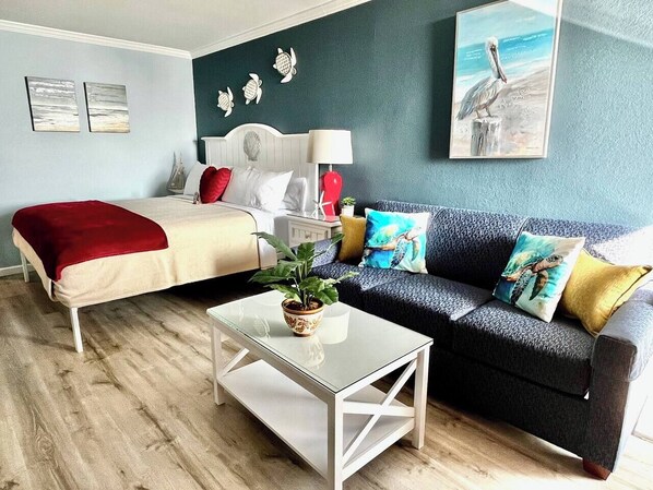 Plush, inviting king-size bed plus pull-out queen sleeper sofa.