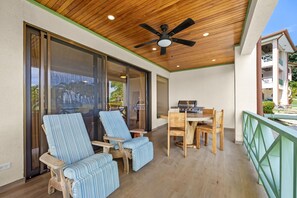 Unwind on a private balcony overlooking Flamingo's white sand beach! This cozy condo includes a BBQ area and all the comforts for a perfect seaside escape