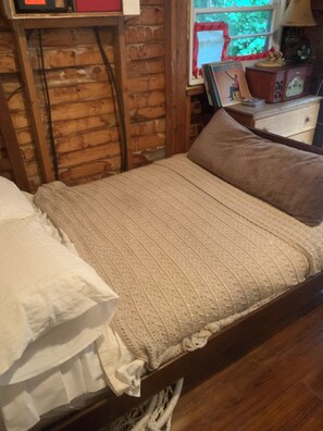 Crisp white linens, plush bedding await in this snug bedroom, queen size bed.