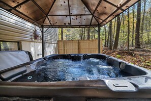 Relax in the private hot tub—perfect for unwinding after a day of adventure