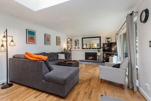 Living room with gas fire place & piano
