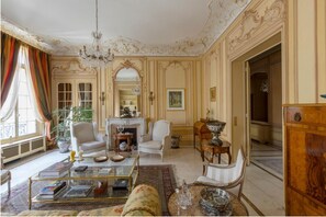 The décor is exquisite, with ornate gilding and glittering crystal chandeliers