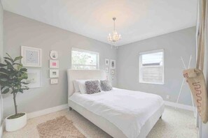 Main bedroom.  Light by day or dark should you choose to lower the blackout shades.