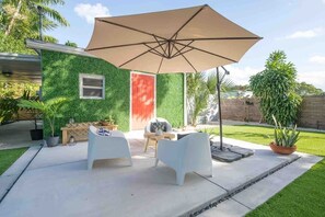 Enjoy the Private backyard seating area while sipping on cold tea!