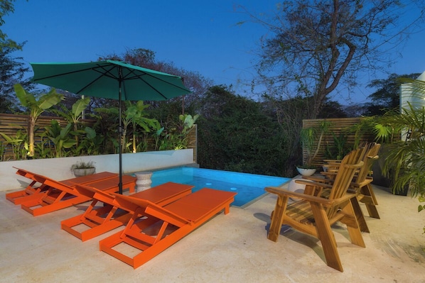 Private pool over looking the estuary at sunset