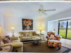 living room with golf course view