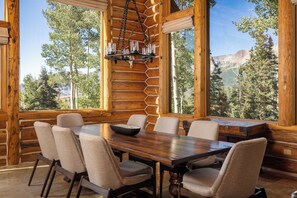 Light and spacious contemporary dining area with comfortable seating for 8 guests