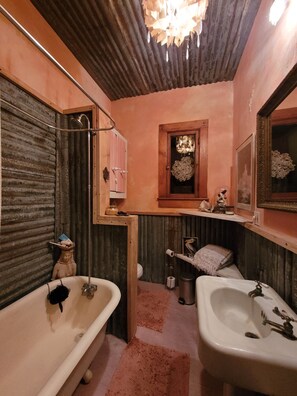 Lovely claw foot tub, shower and toilet.