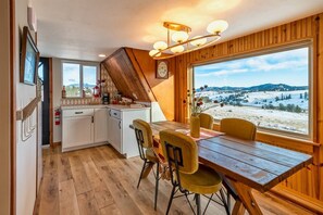 Enjoy the mountain views from the dining room located off the kitchen. 