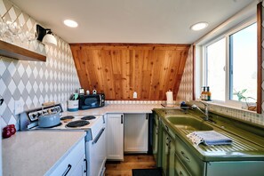 Quaint kitchen with all the essentials and vintage inspired appliances