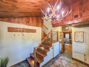 Guests will walk into a spacious entry way with plenty of hooks and storage for shoes, and jackets. We provide snowshoes, coolers, and bear spray for your adventures. 