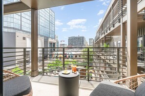 Unit 2: Private patio off the living room and primary bedroom offering a gorgeous view of the pool and Music City!