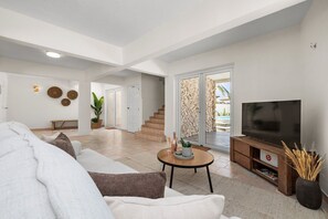 With soft lighting and tasteful decor, this living area creates a cozy atmosphere, ideal for both quiet evenings in and lively gatherings with family and friends