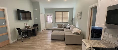 Open living/dining area. Table will accommodate 4 people for a sit down meal.