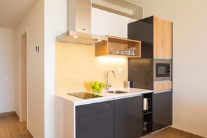 Unit with fully equipped kitchen