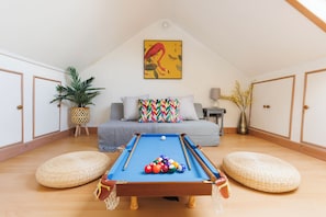 Games room with pool table and sofa 